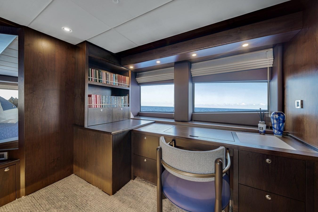 a room with a desk and a window aboard MOONEN ROYAL DENSHIP 120 Yacht for Sale