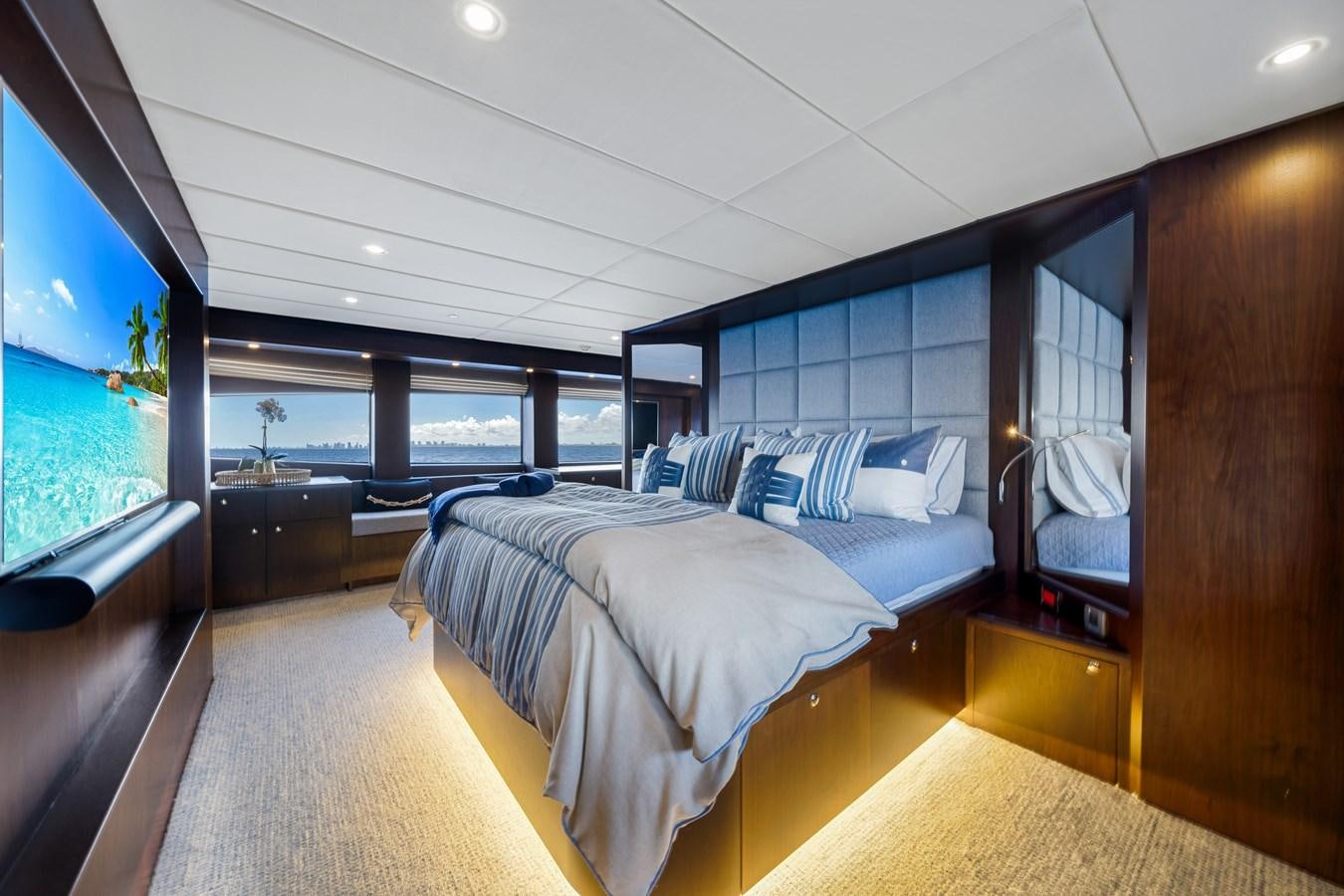 a room with a bed and a large window aboard MOONEN ROYAL DENSHIP 120 Yacht for Sale