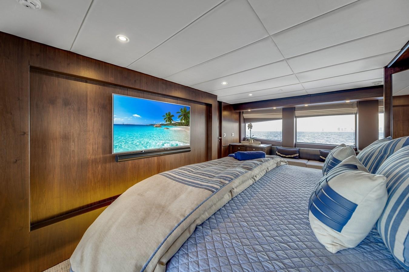 a room with a bed and a television aboard MOONEN ROYAL DENSHIP 120 Yacht for Sale