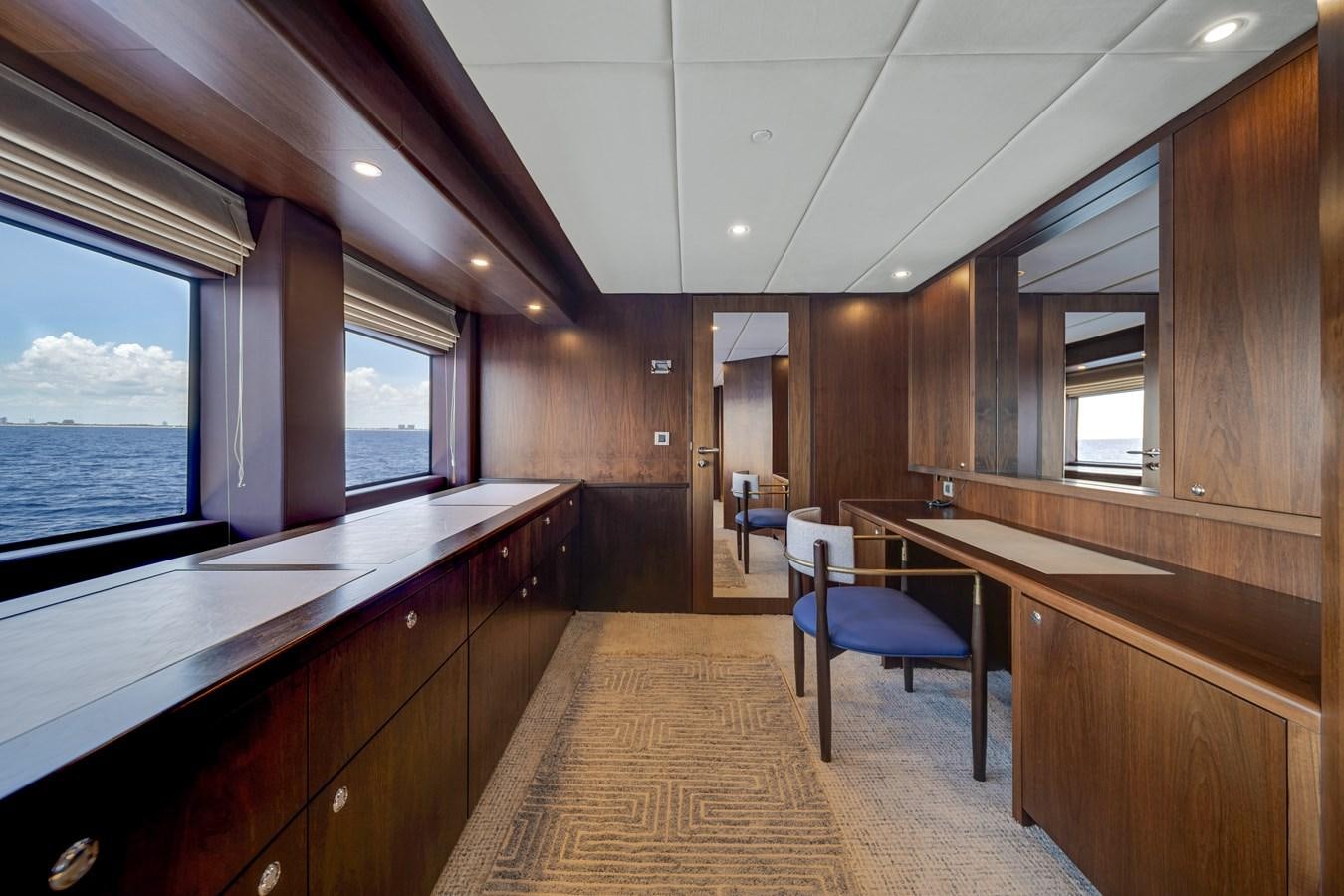 a large kitchen with wooden cabinets aboard MOONEN ROYAL DENSHIP 120 Yacht for Sale