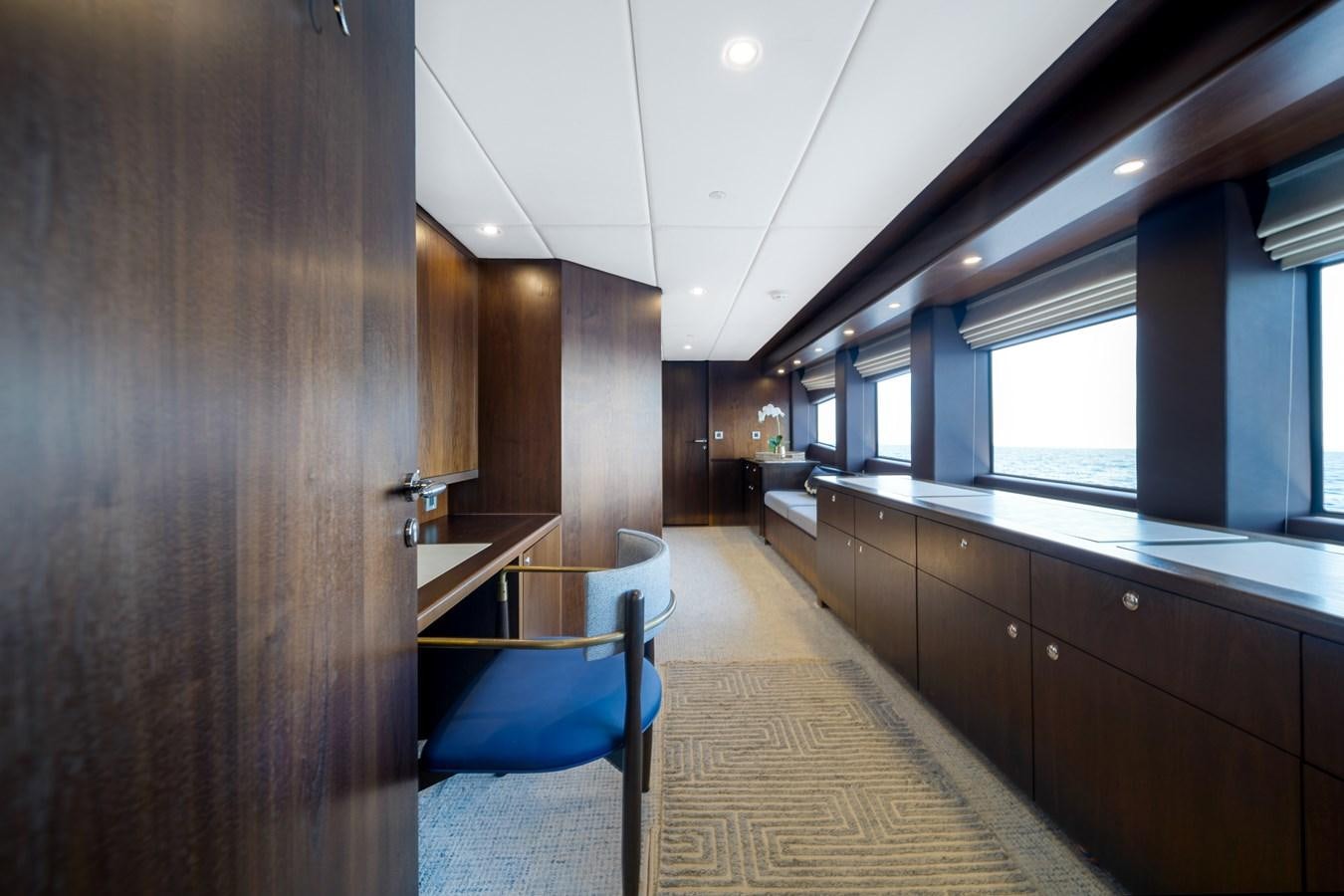 a long hallway with a counter and chairs aboard MOONEN ROYAL DENSHIP 120 Yacht for Sale