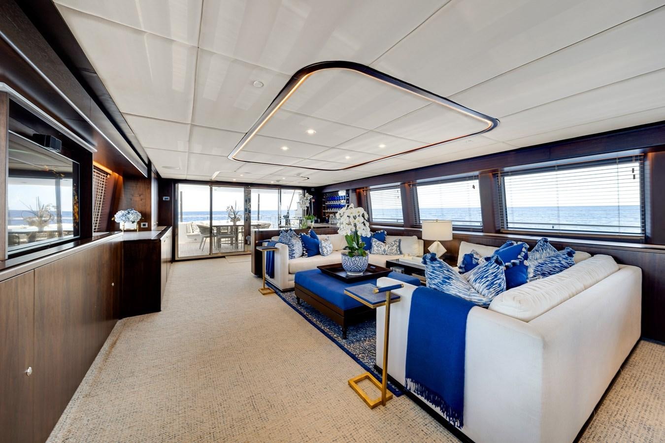 a large living room with a large window aboard MOONEN ROYAL DENSHIP 120 Yacht for Sale