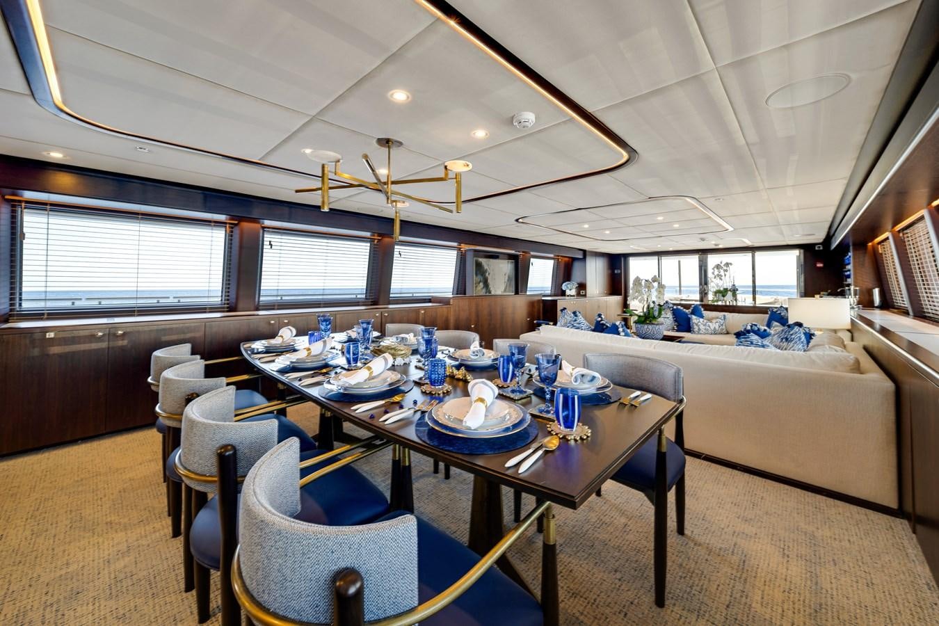 a large dining room with a large table and chairs aboard MOONEN ROYAL DENSHIP 120 Yacht for Sale