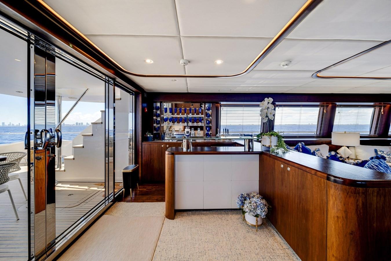 a large room with a glass door aboard MOONEN ROYAL DENSHIP 120 Yacht for Sale