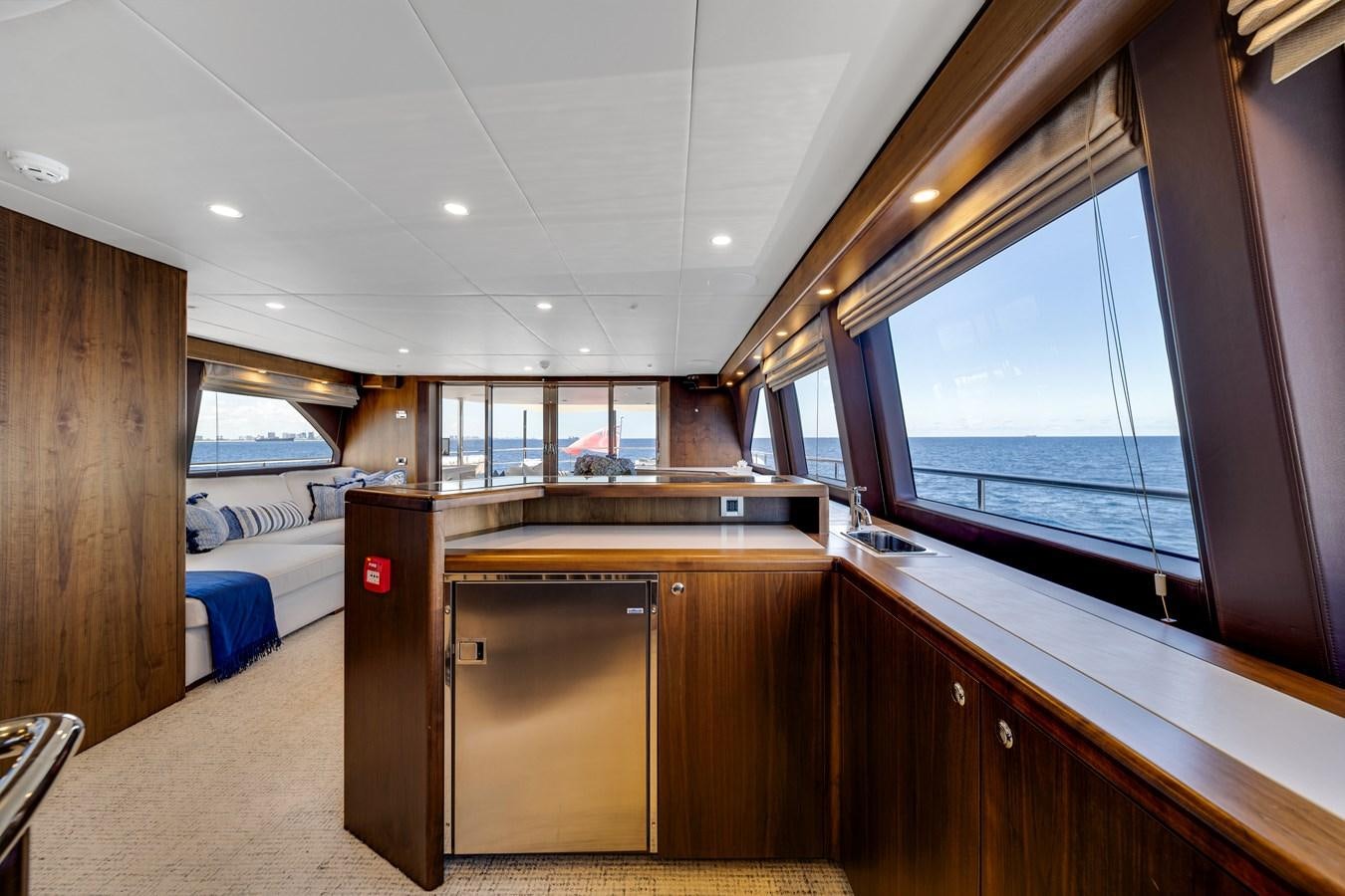 a room with a bed and a window aboard MOONEN ROYAL DENSHIP 120 Yacht for Sale