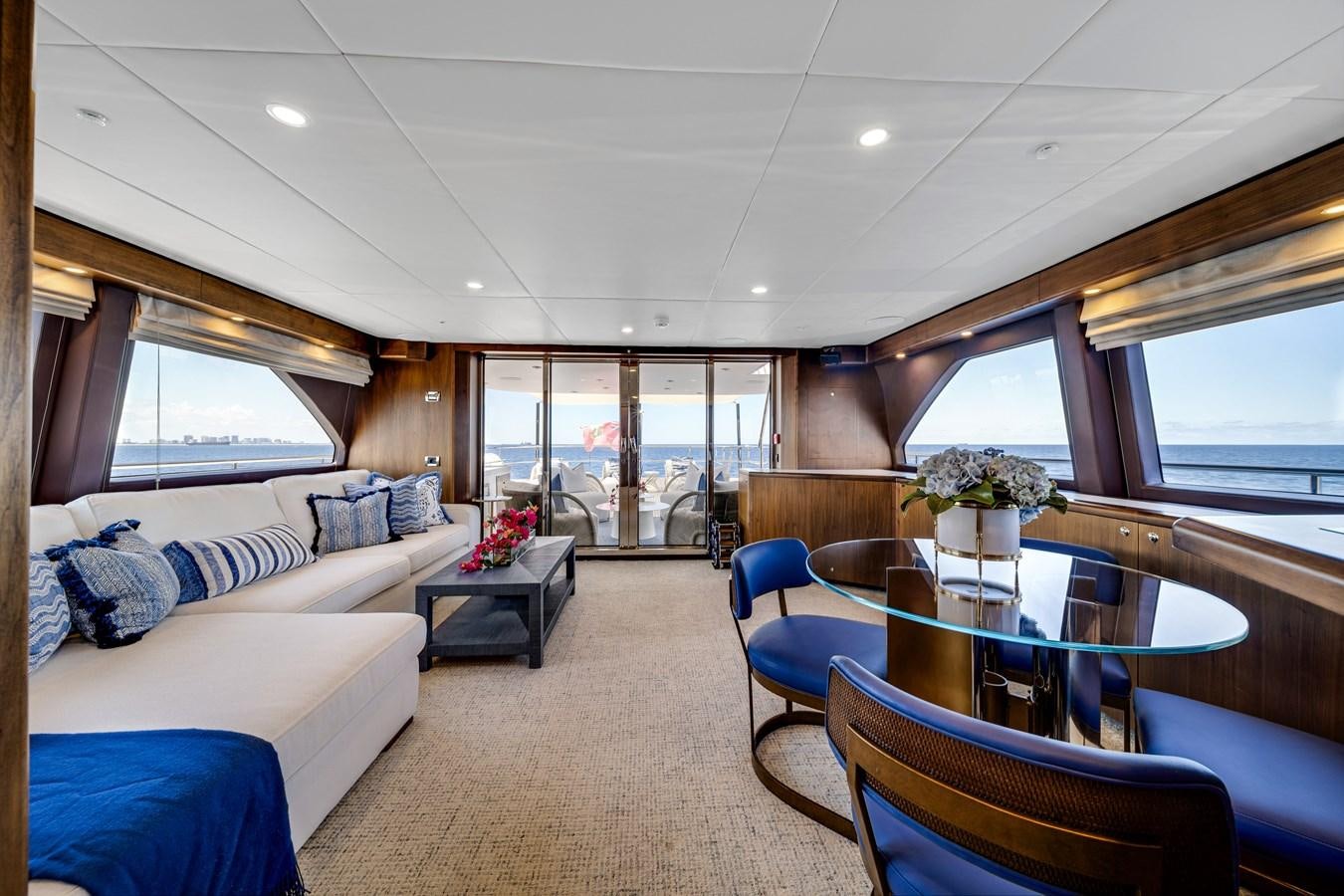 a living room with a large window aboard MOONEN ROYAL DENSHIP 120 Yacht for Sale