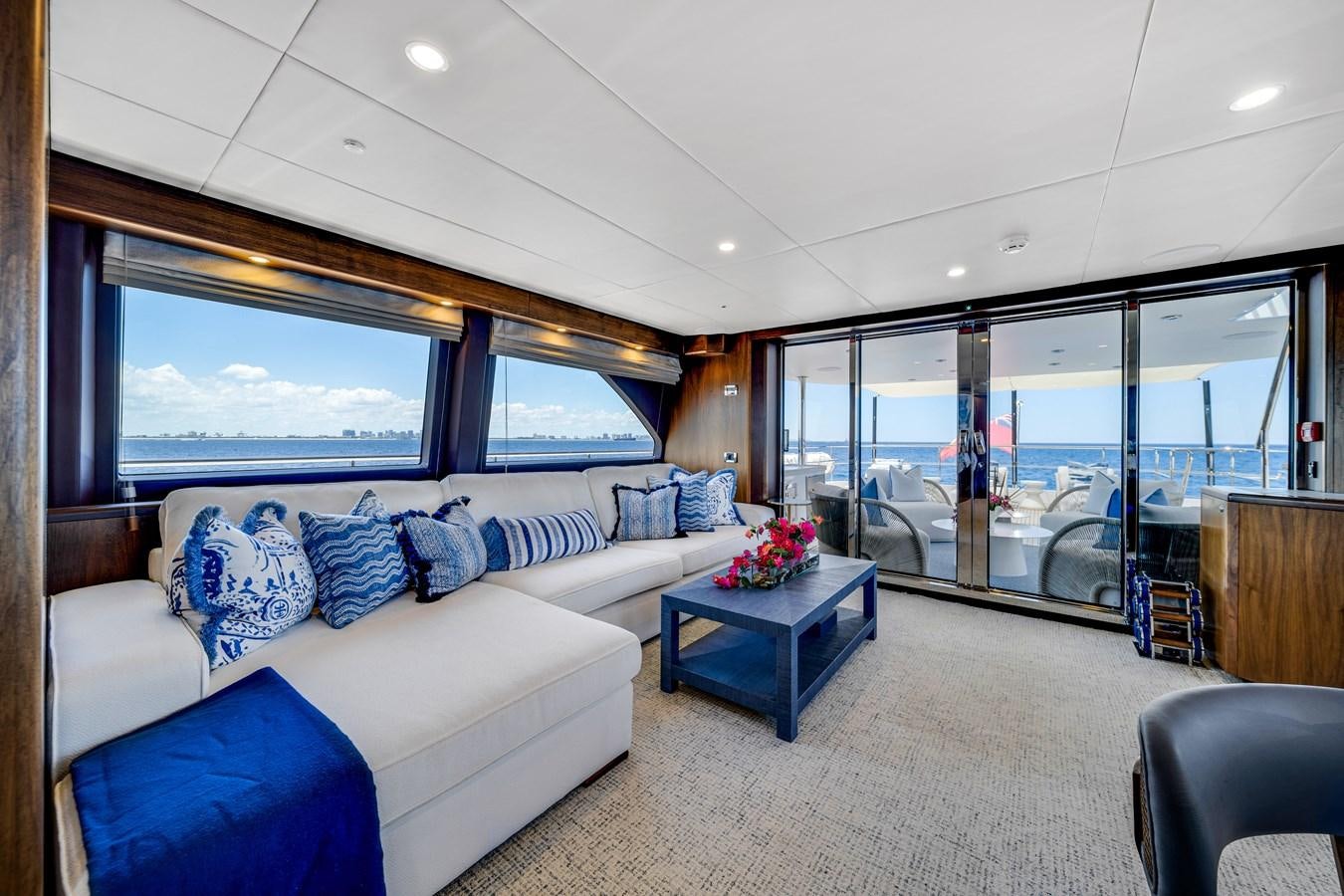 a living room with a large window aboard MOONEN ROYAL DENSHIP 120 Yacht for Sale