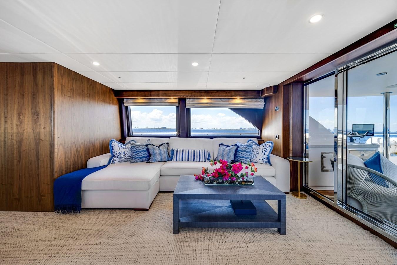 a living room with a large window aboard MOONEN ROYAL DENSHIP 120 Yacht for Sale