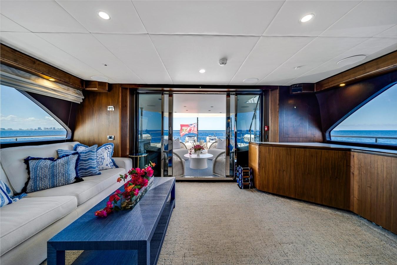 a room with a couch and a table aboard MOONEN ROYAL DENSHIP 120 Yacht for Sale