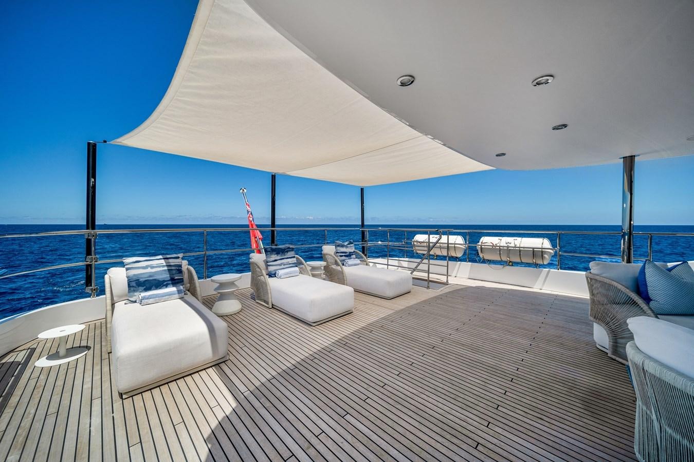 a deck with chairs and a large body of water aboard MOONEN ROYAL DENSHIP 120 Yacht for Sale