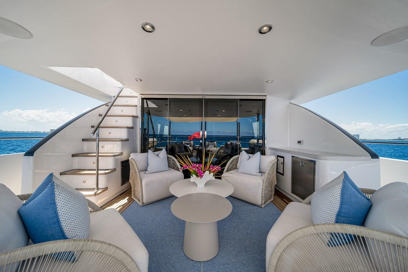 a living room with a large window aboard MOONEN ROYAL DENSHIP 120 Yacht for Sale