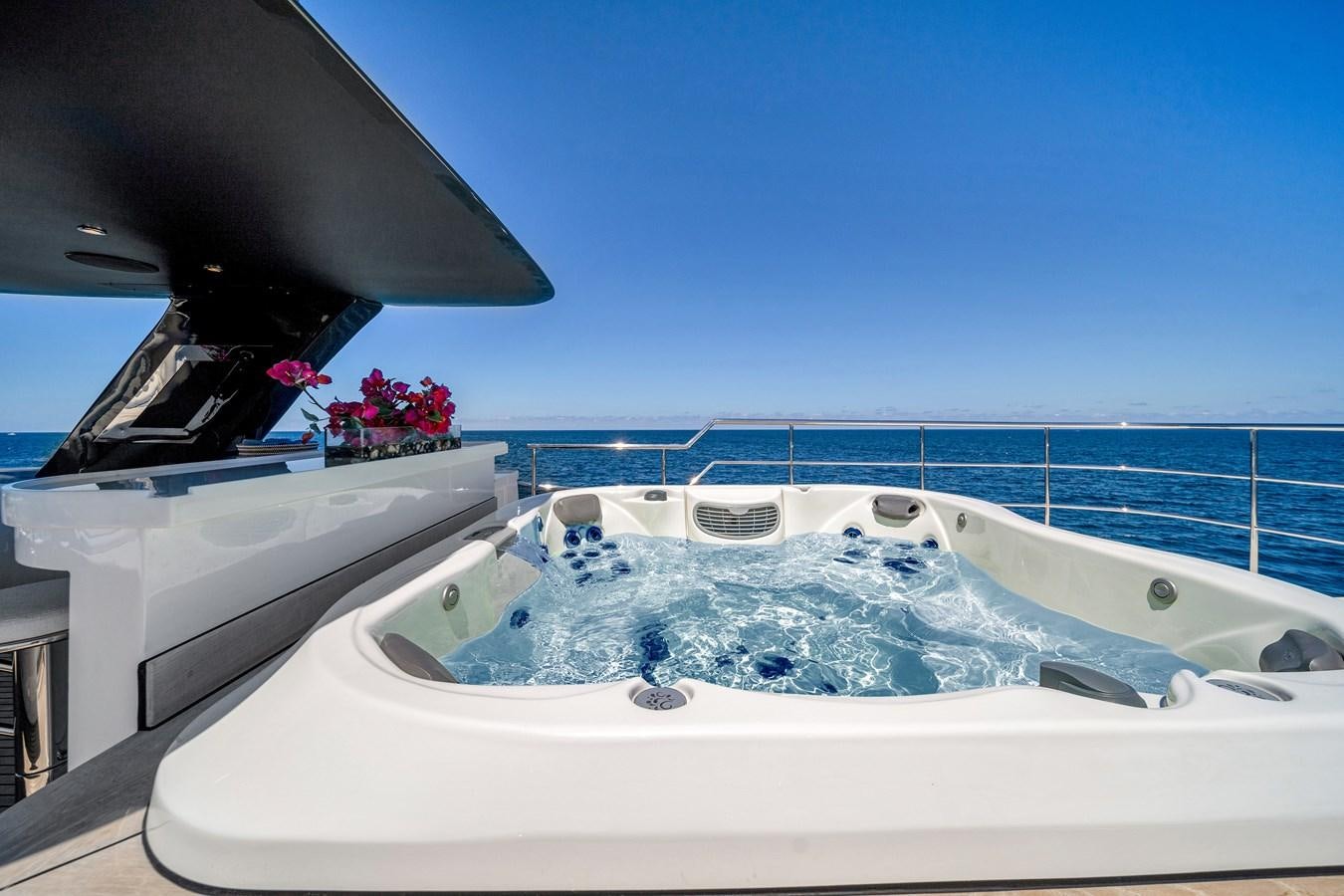 a bathtub with a flower in the window aboard MOONEN ROYAL DENSHIP 120 Yacht for Sale