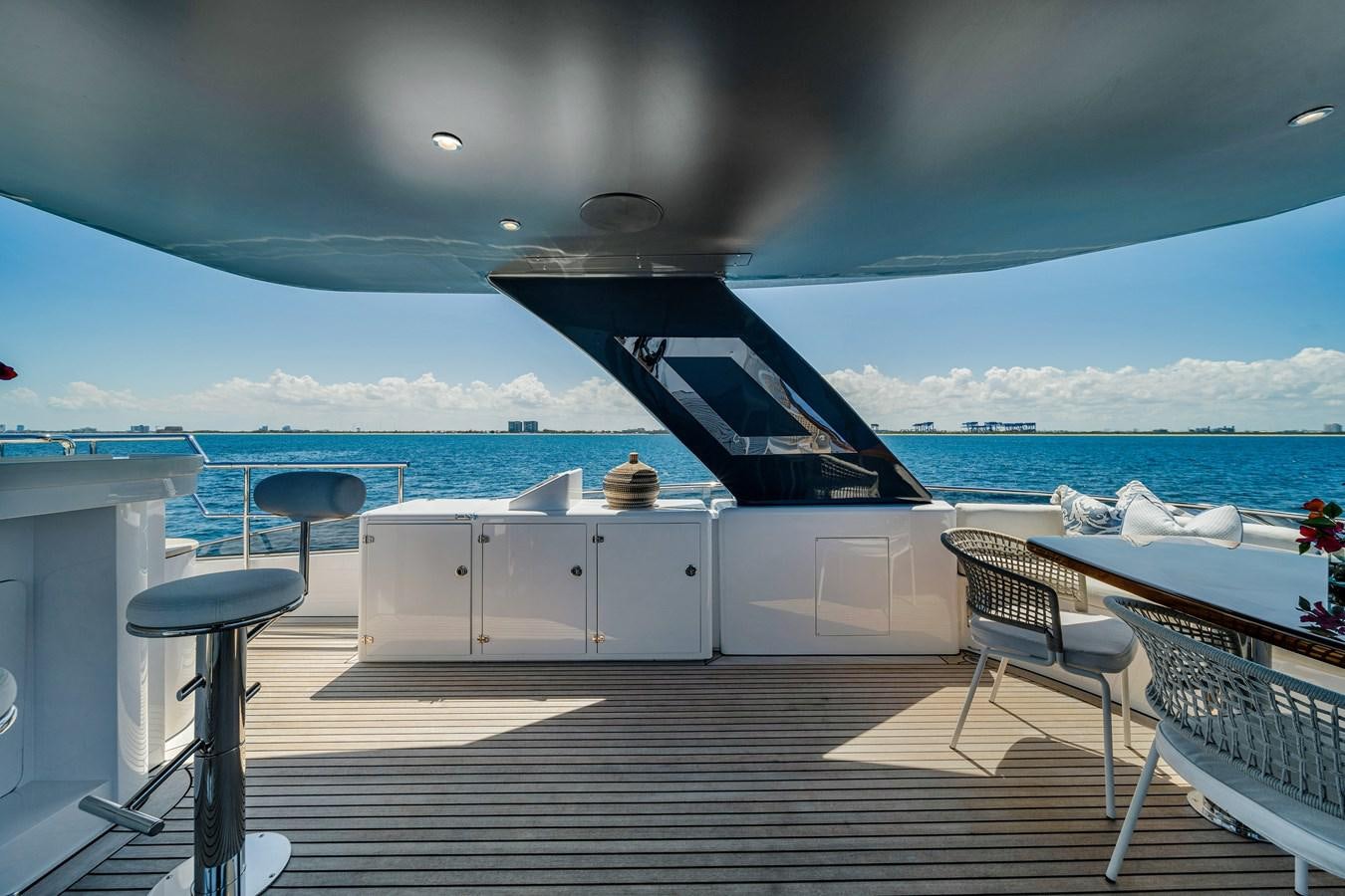 a deck with a large ship in the background aboard MOONEN ROYAL DENSHIP 120 Yacht for Sale