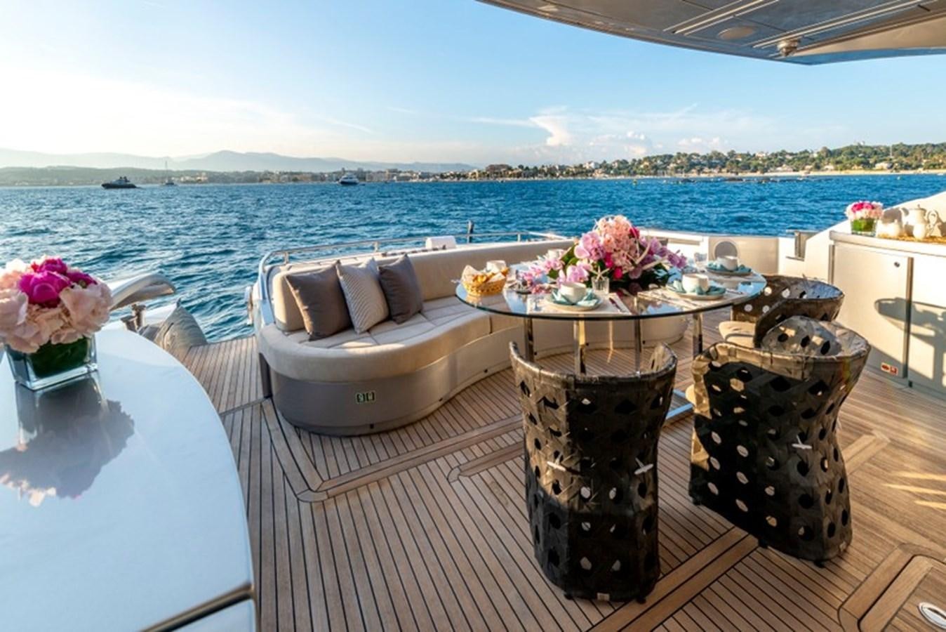 a table with flowers on it aboard LEVANTINE II Yacht for Sale