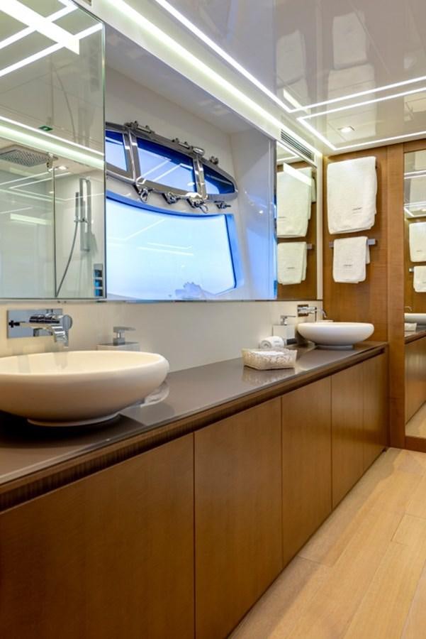 a bathroom with a large mirror aboard LEVANTINE II Yacht for Sale