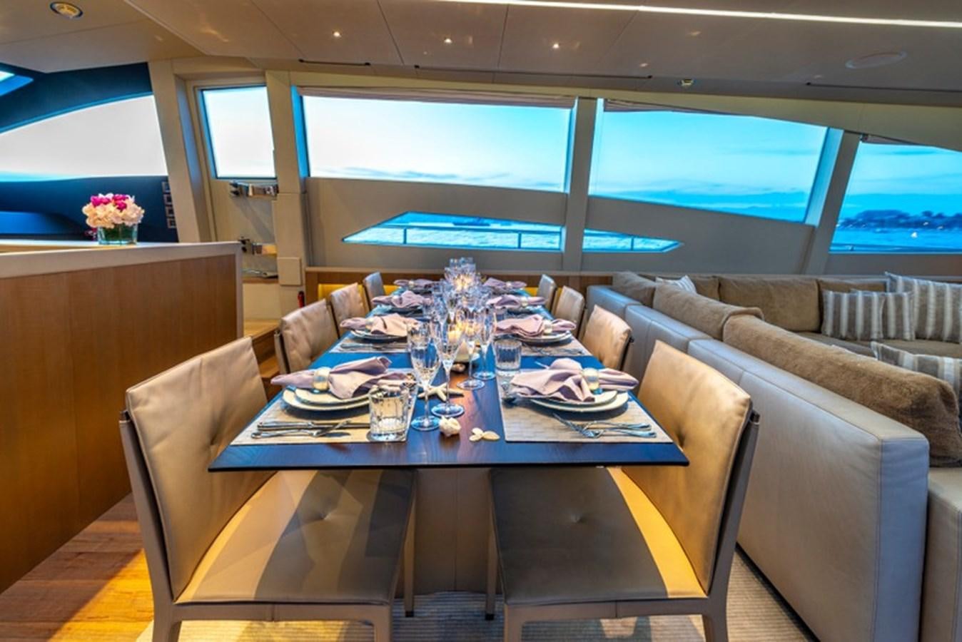 a dining table in a room aboard LEVANTINE II Yacht for Sale