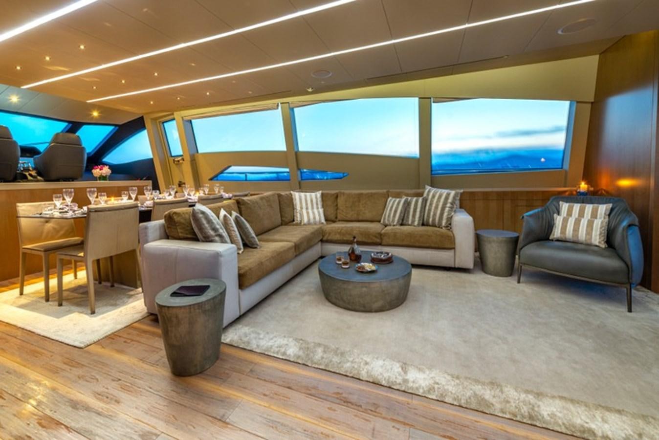 a living room with a large screen aboard LEVANTINE II Yacht for Sale