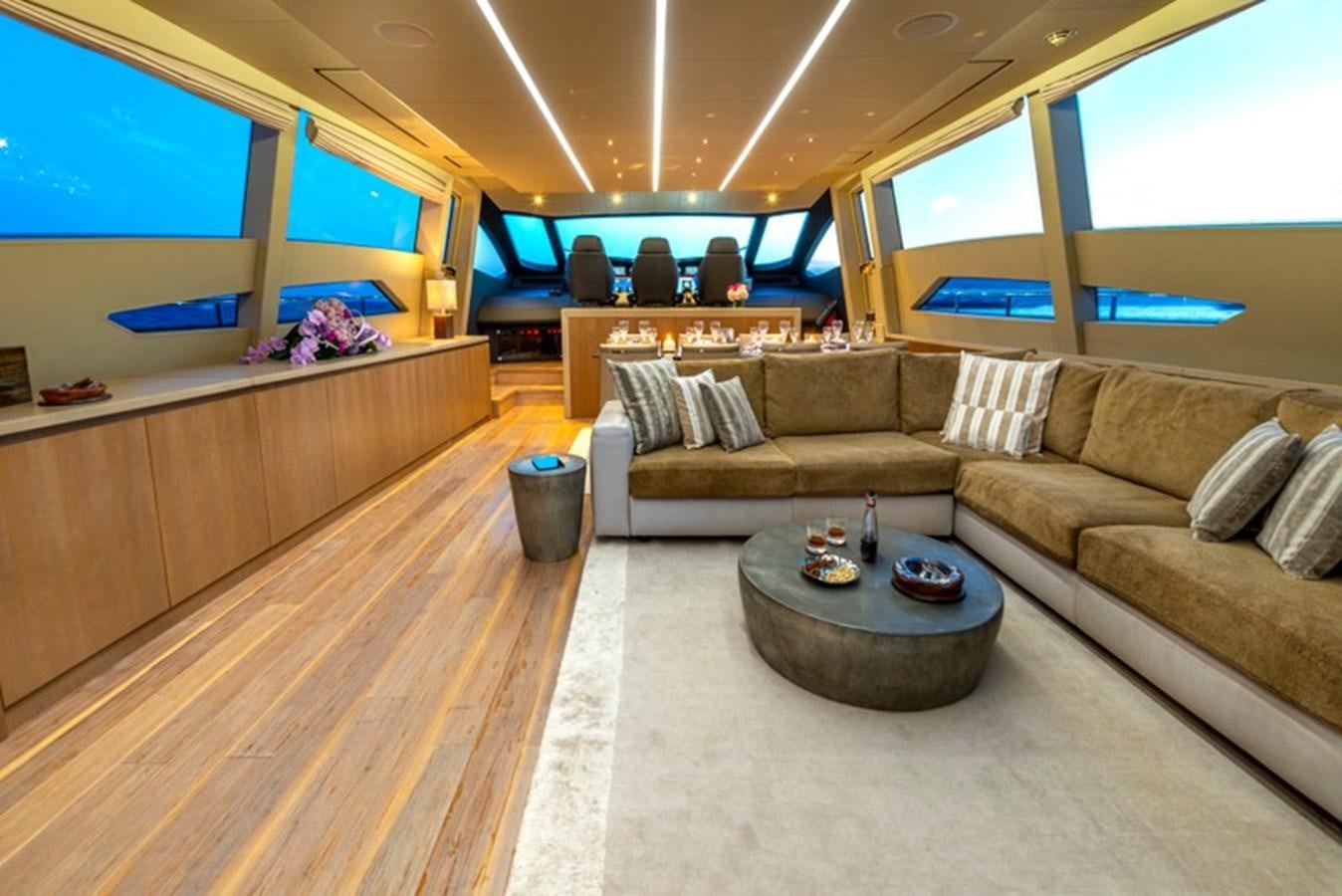 a living room with a couch and a coffee table aboard LEVANTINE II Yacht for Sale