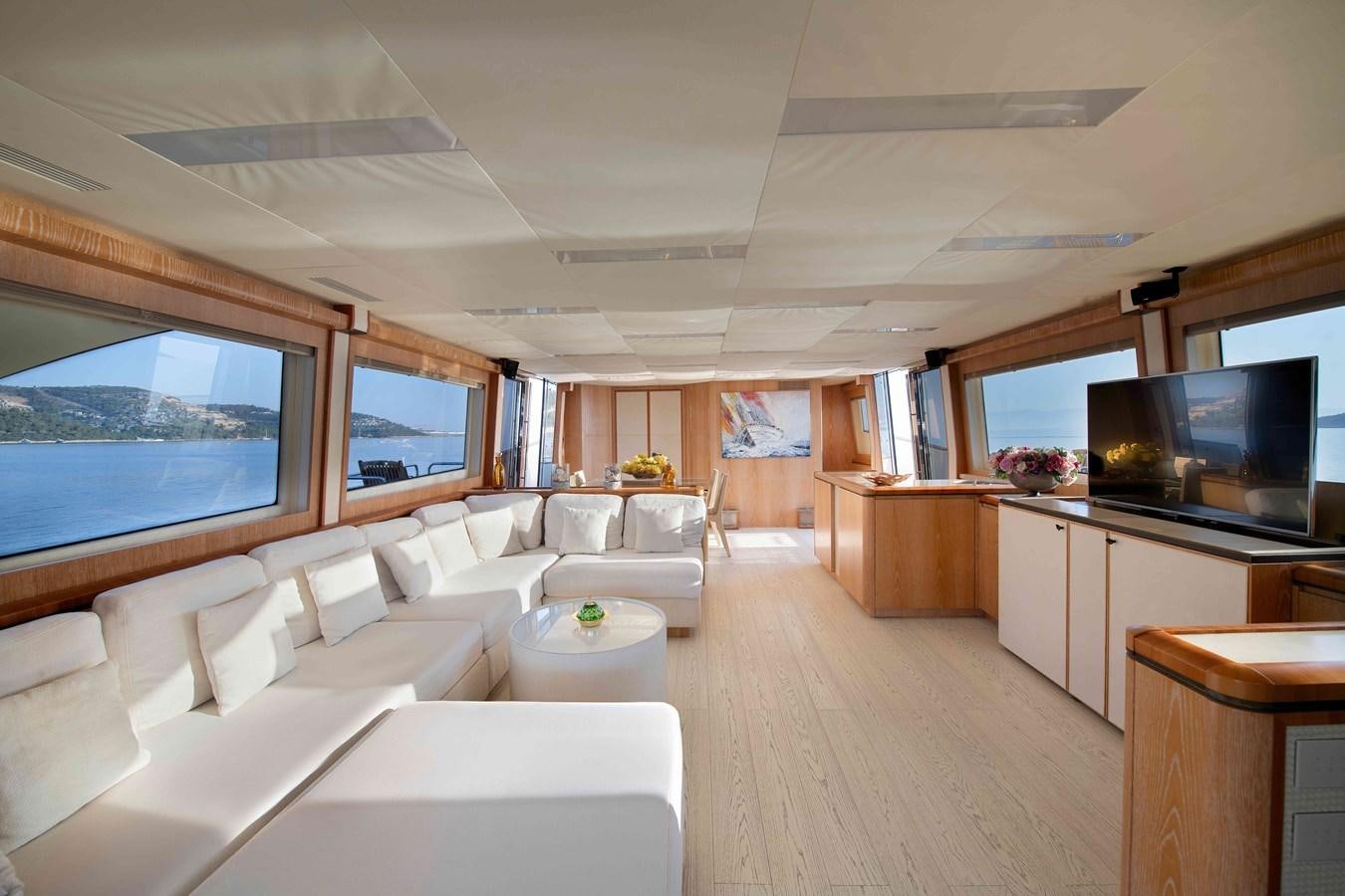 a living room with a large window aboard ANDIAMO Yacht for Sale