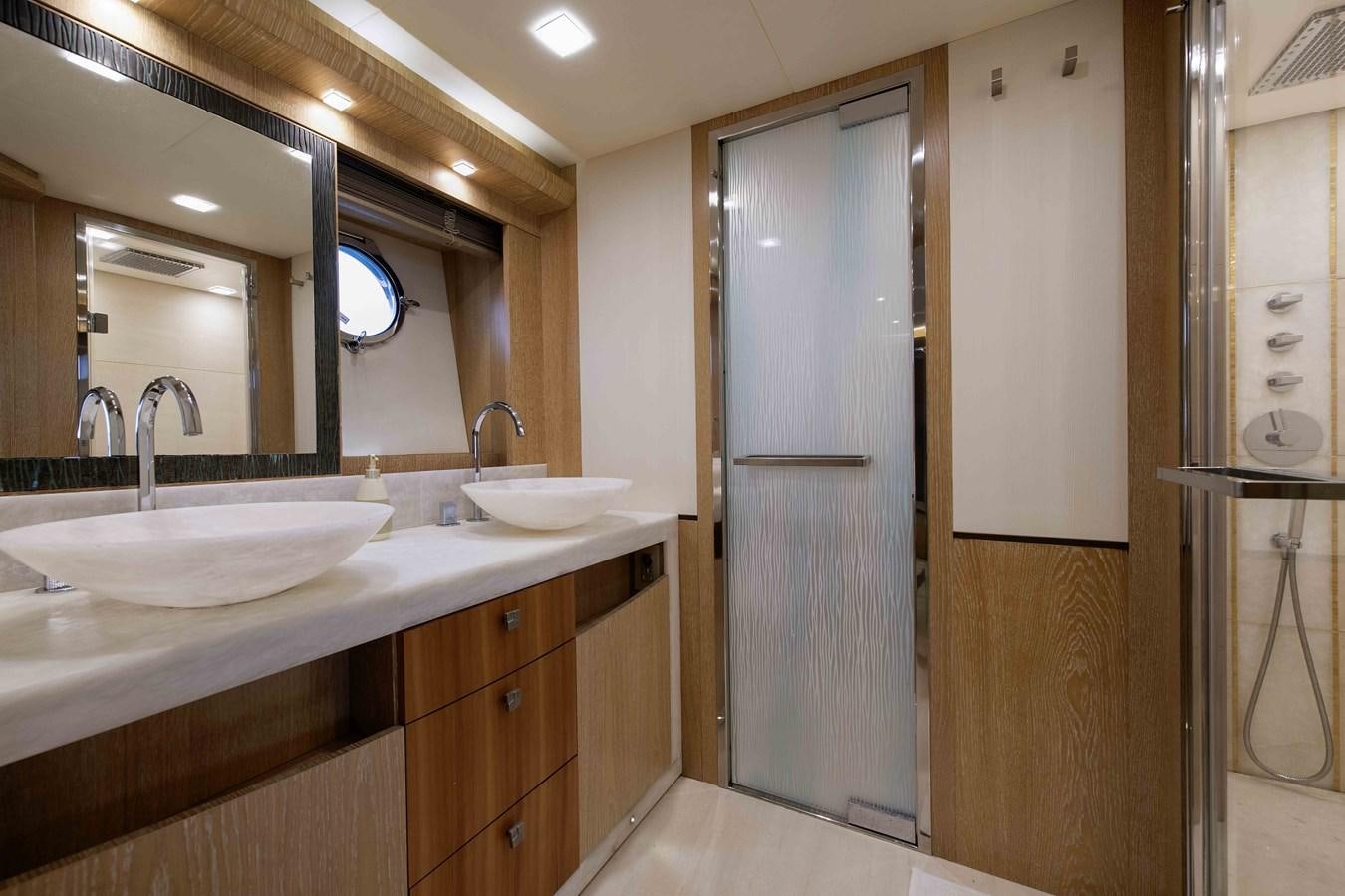 a bathroom with a sink and a mirror aboard ANDIAMO Yacht for Sale
