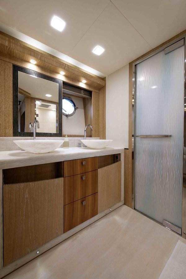 a bathroom with a sink and a mirror aboard ANDIAMO Yacht for Sale