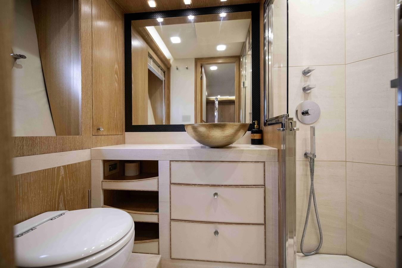 a bathroom with a sink and a toilet aboard ANDIAMO Yacht for Sale