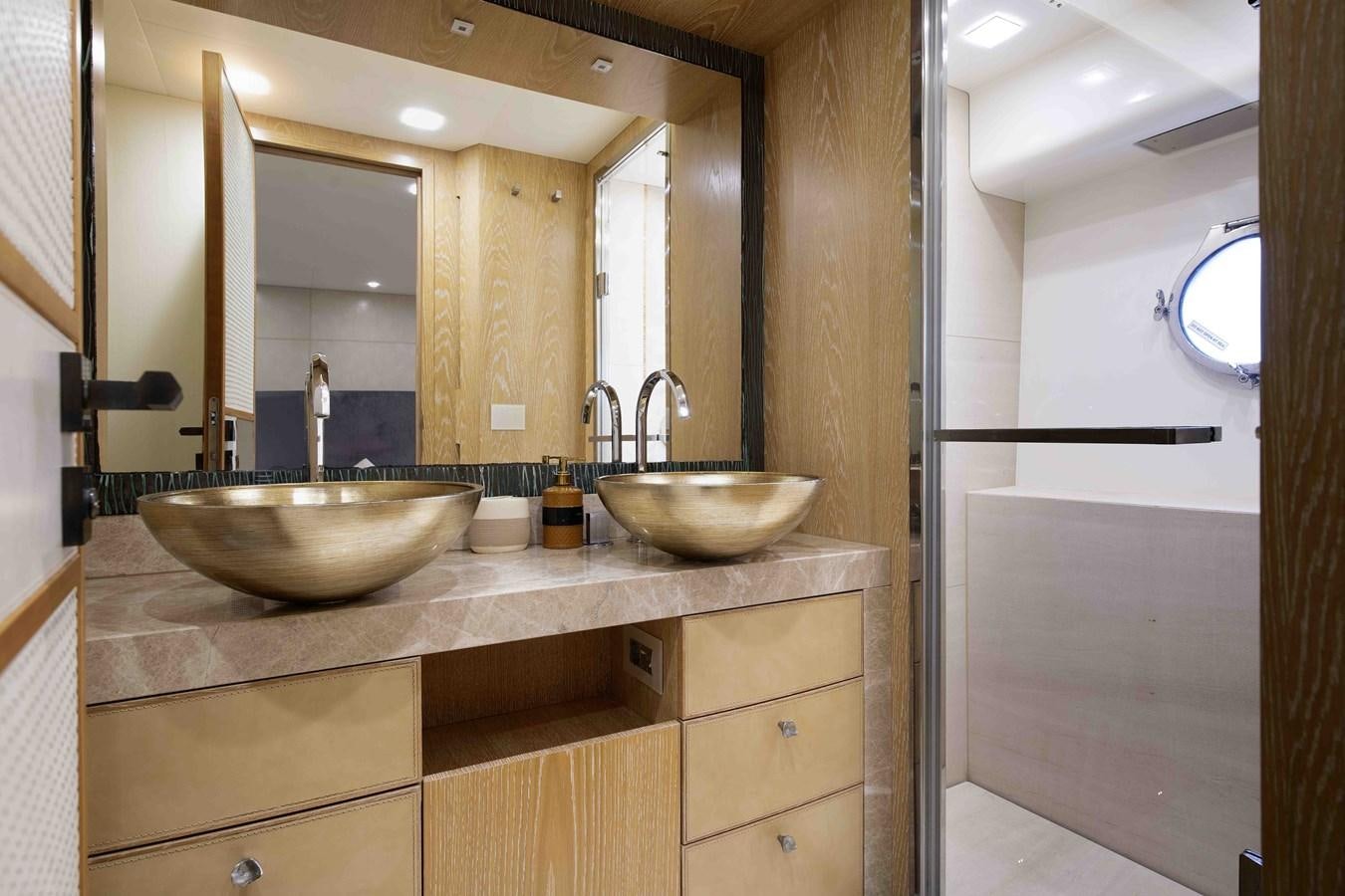 a bathroom with two sinks aboard ANDIAMO Yacht for Sale