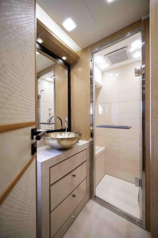 a bathroom with a sink and a mirror aboard ANDIAMO Yacht for Sale