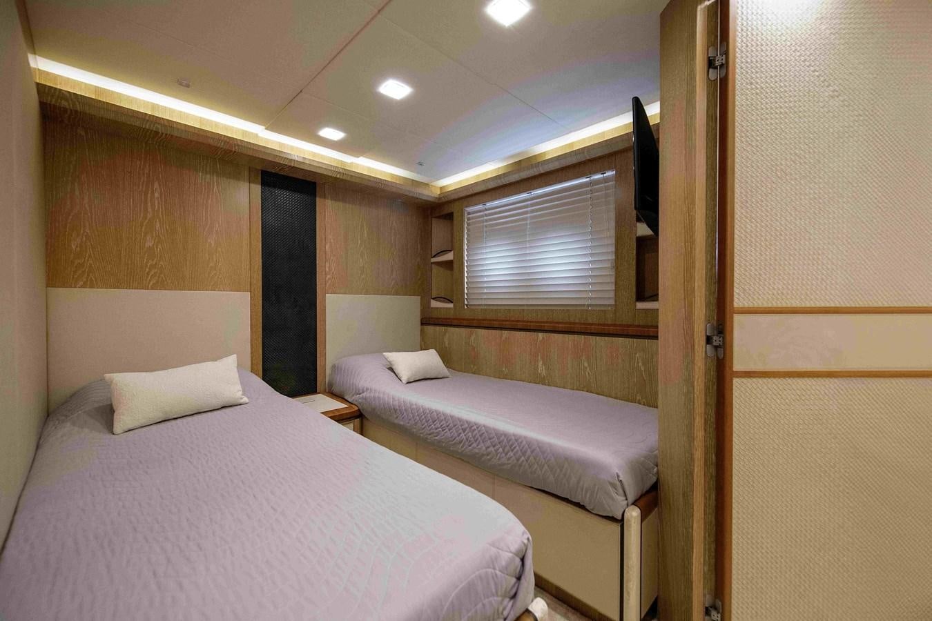 a room with two beds aboard ANDIAMO Yacht for Sale