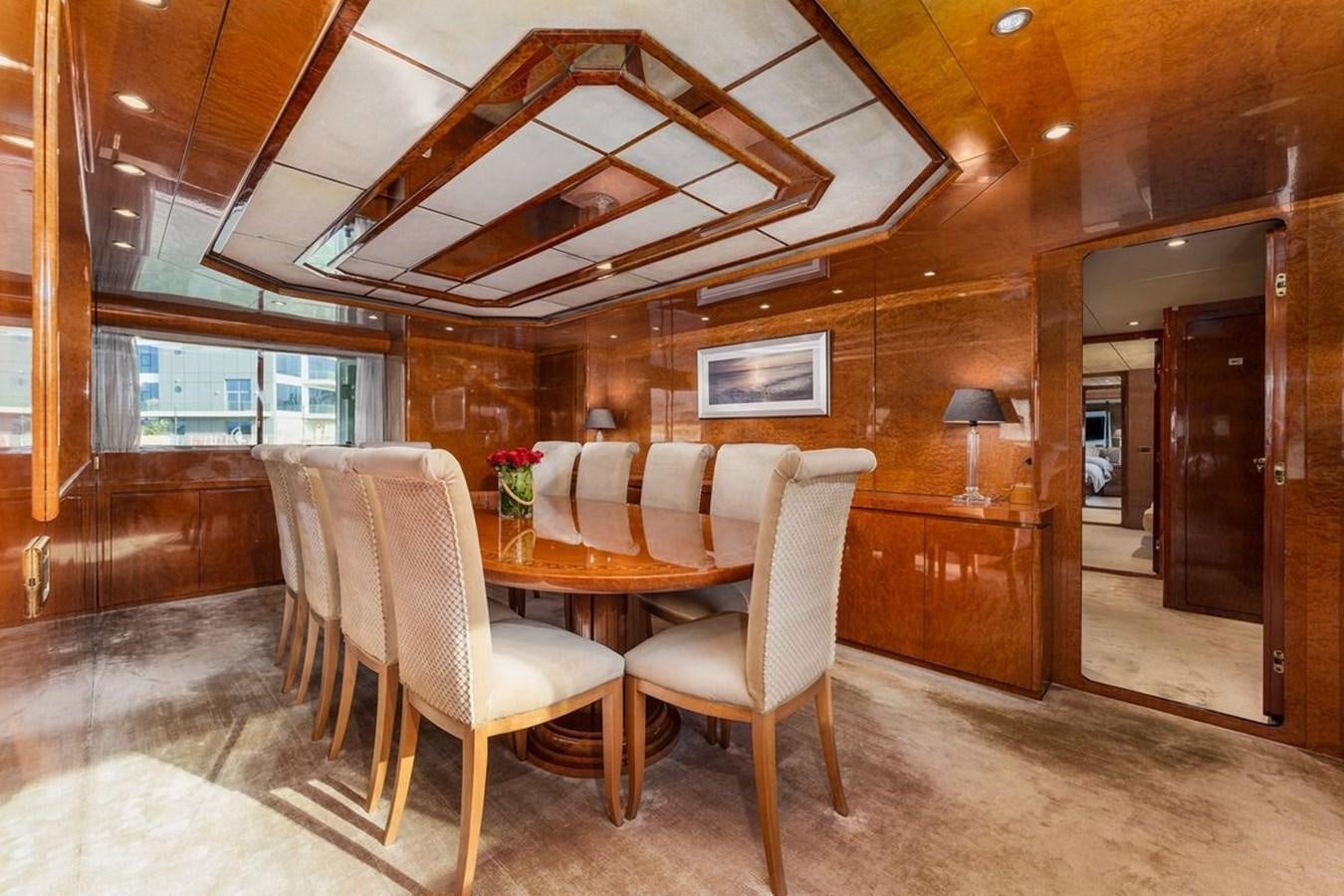 a dining room with wood walls aboard ALIA 7 Yacht for Sale