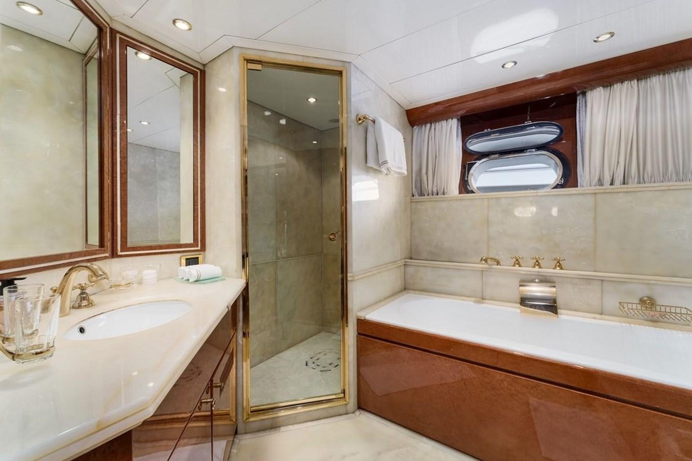 a bathroom with a tub sink and a sink aboard ALIA 7 Yacht for Sale