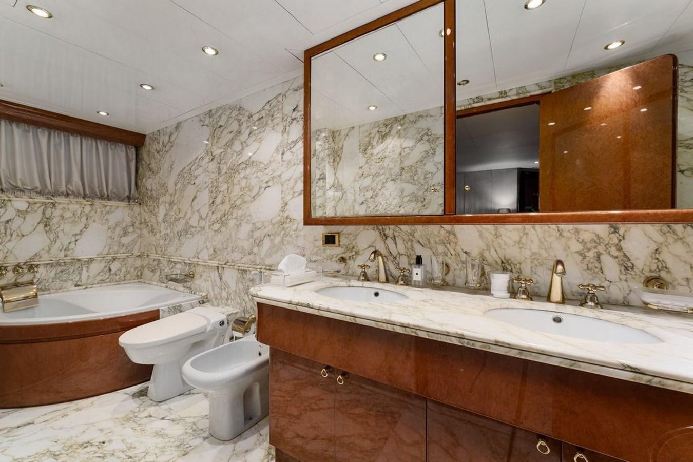 a bathroom with a large mirror aboard ALIA 7 Yacht for Sale