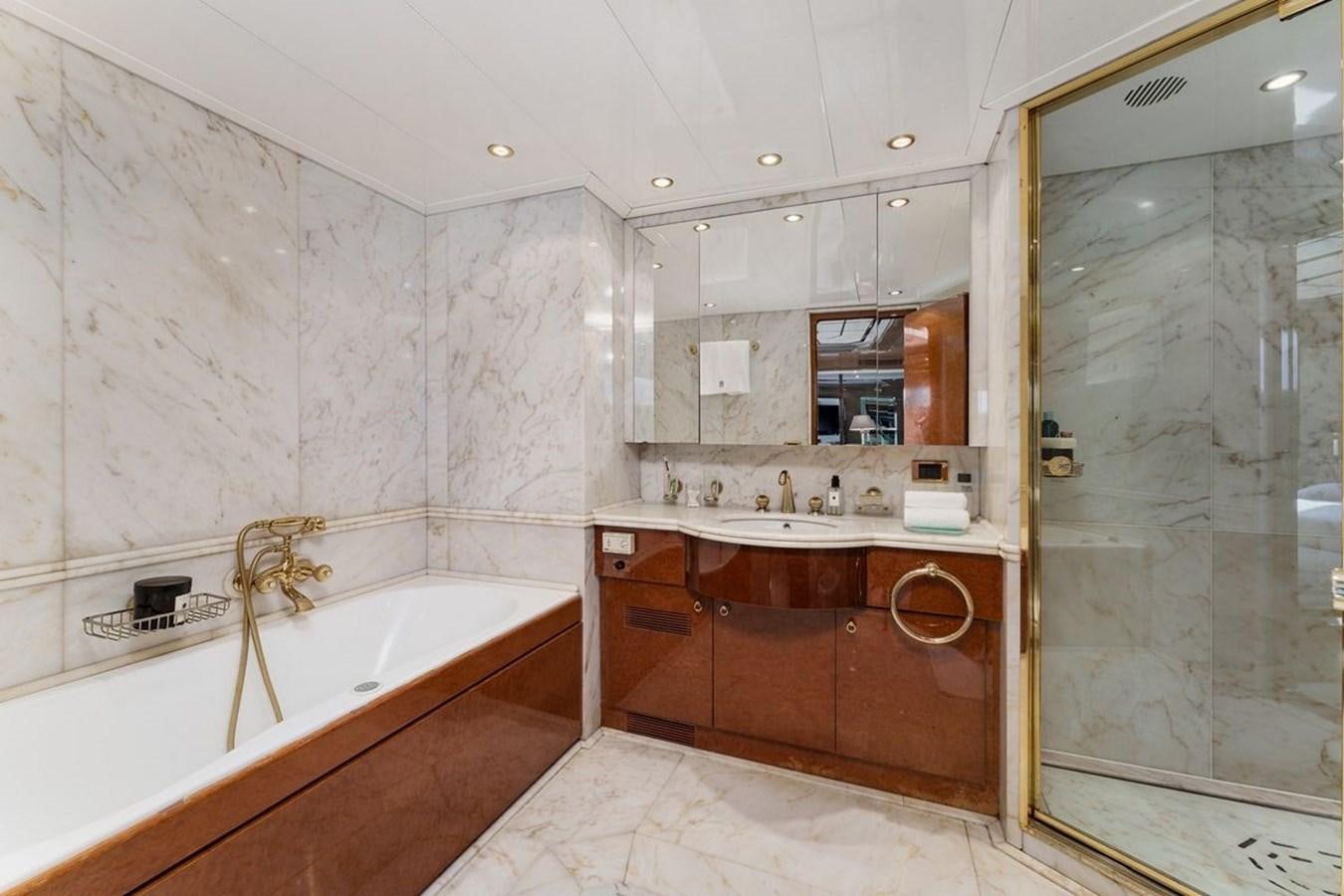a bathroom with a tub sink and a shower unit aboard ALIA 7 Yacht for Sale