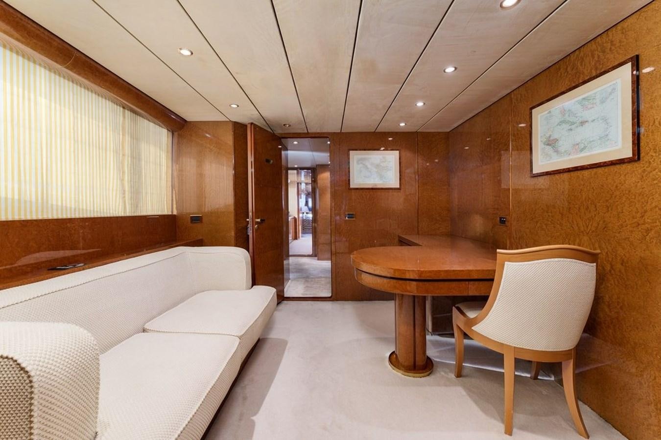 a room with a table and chairs aboard ALIA 7 Yacht for Sale