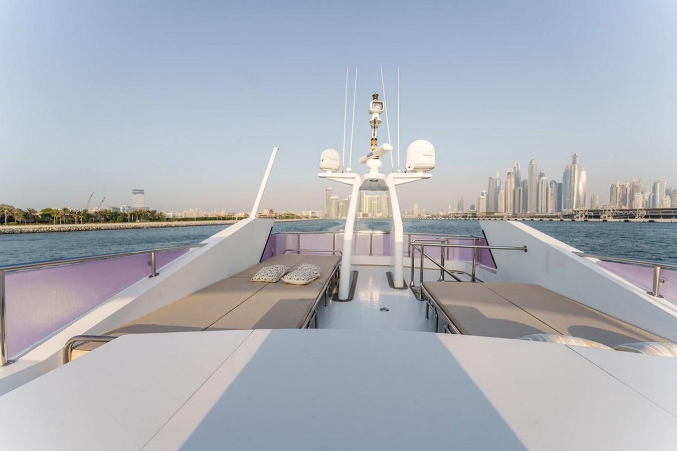 a large white ship on a dock aboard ALIA 7 Yacht for Sale