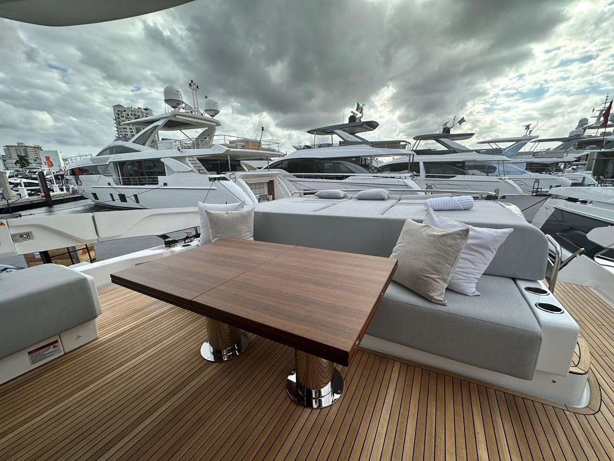 a deck with a row of boats aboard SUNSET 8 Yacht for Sale