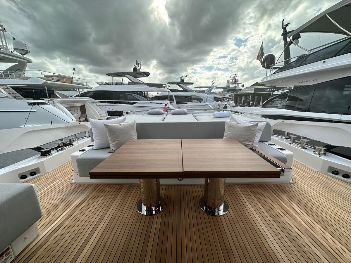 a table with a bench on it aboard SUNSET 8 Yacht for Sale