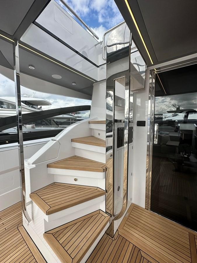 a room with a wood floor and a wood staircase aboard SUNSET 8 Yacht for Sale