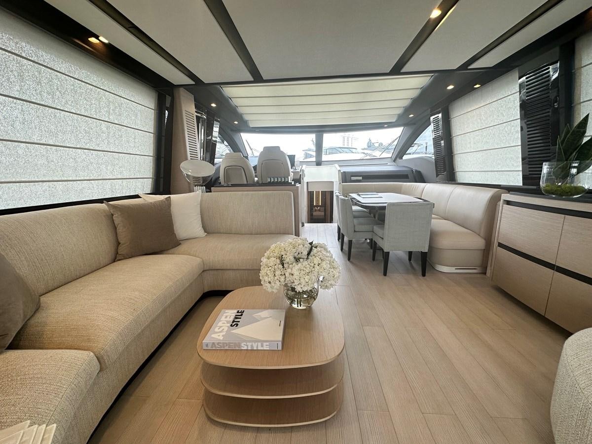 a living room with a wood floor aboard SUNSET 8 Yacht for Sale