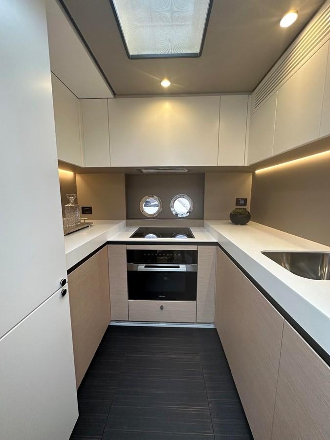 a kitchen with a stove and sink aboard SUNSET 8 Yacht for Sale