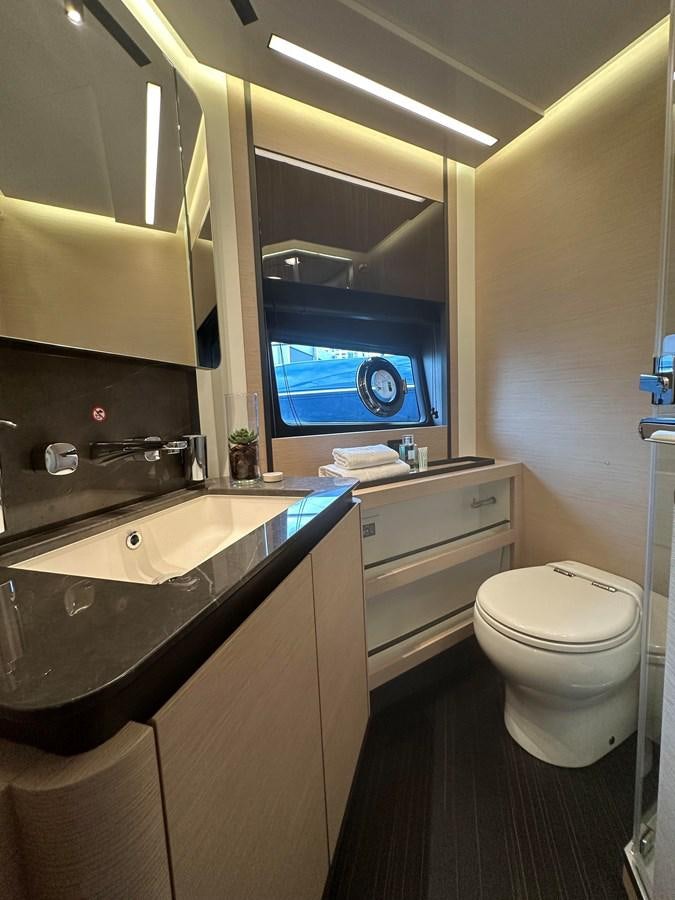 a bathroom with a large window aboard SUNSET 8 Yacht for Sale