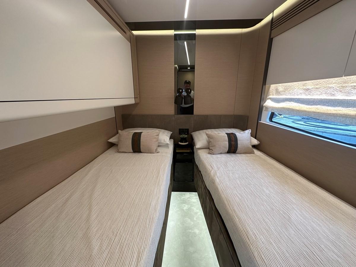 a room with a bed and a mirror aboard SUNSET 8 Yacht for Sale