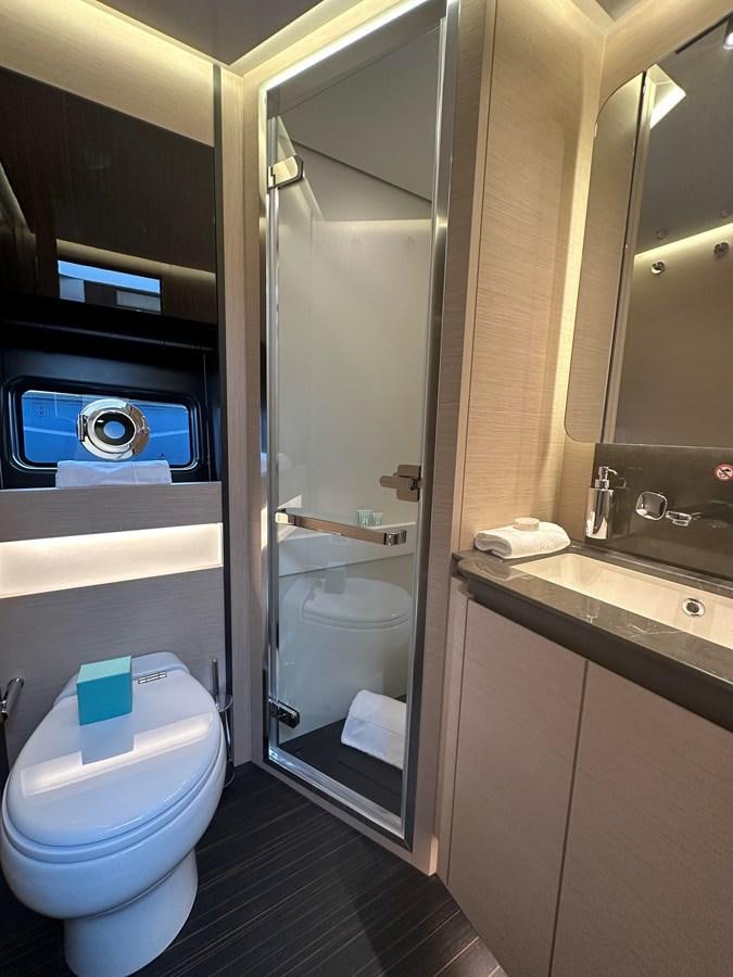 a bathroom with a toilet and a sink aboard SUNSET 8 Yacht for Sale