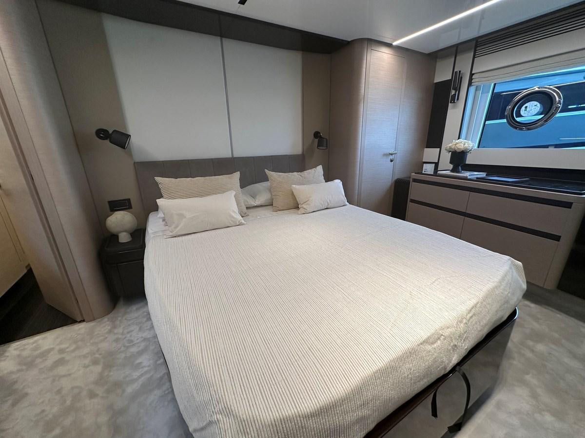 a bed with white sheets aboard SUNSET 8 Yacht for Sale