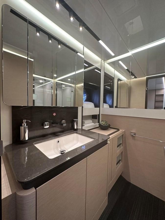 a bathroom with a large mirror aboard SUNSET 8 Yacht for Sale