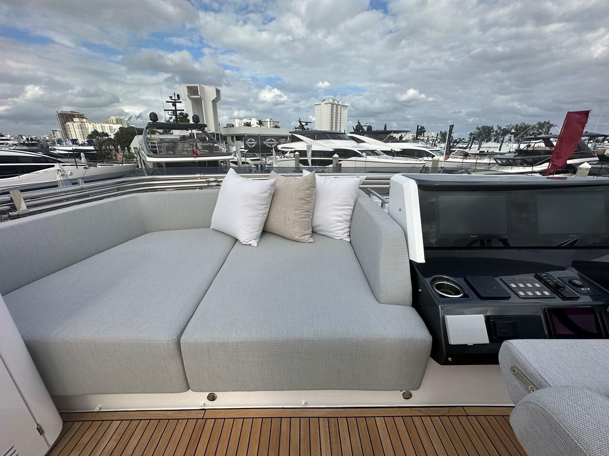 a room with a bed and a large window overlooking a city aboard SUNSET 8 Yacht for Sale