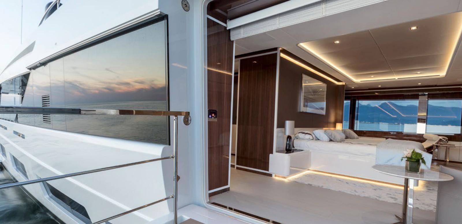 a room with a table and a window aboard GOLDENEYE Yacht for Sale