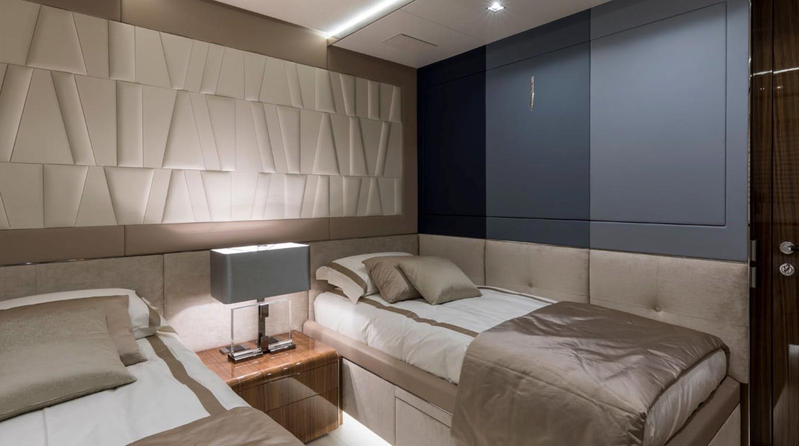 a room with a couple of beds aboard GOLDENEYE Yacht for Sale