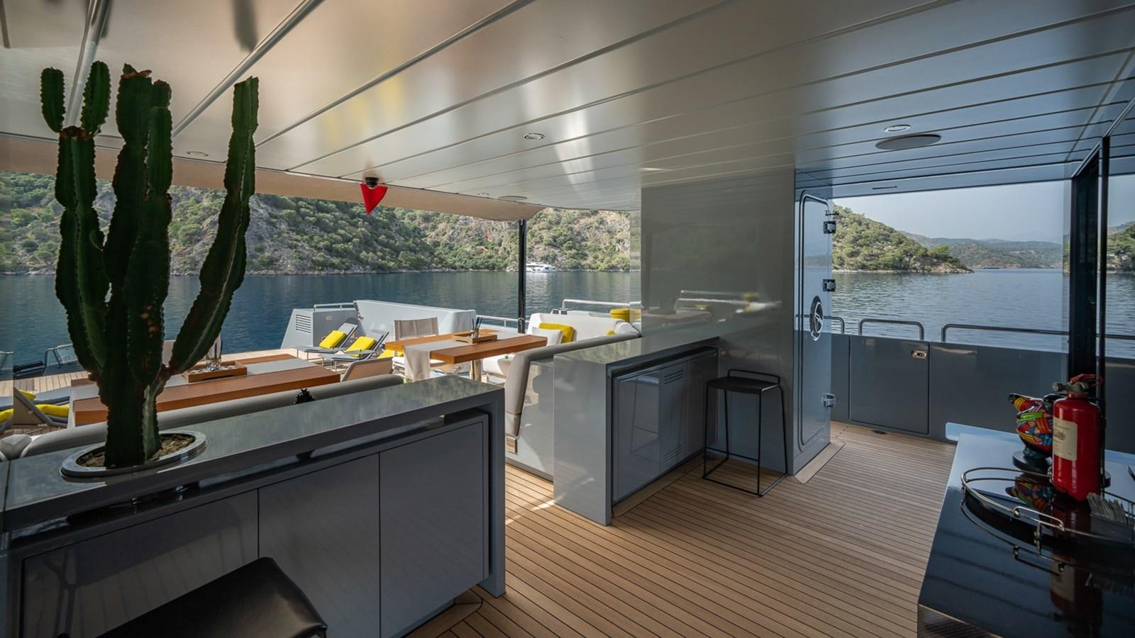 a kitchen with a large window aboard ESOSH Yacht for Sale