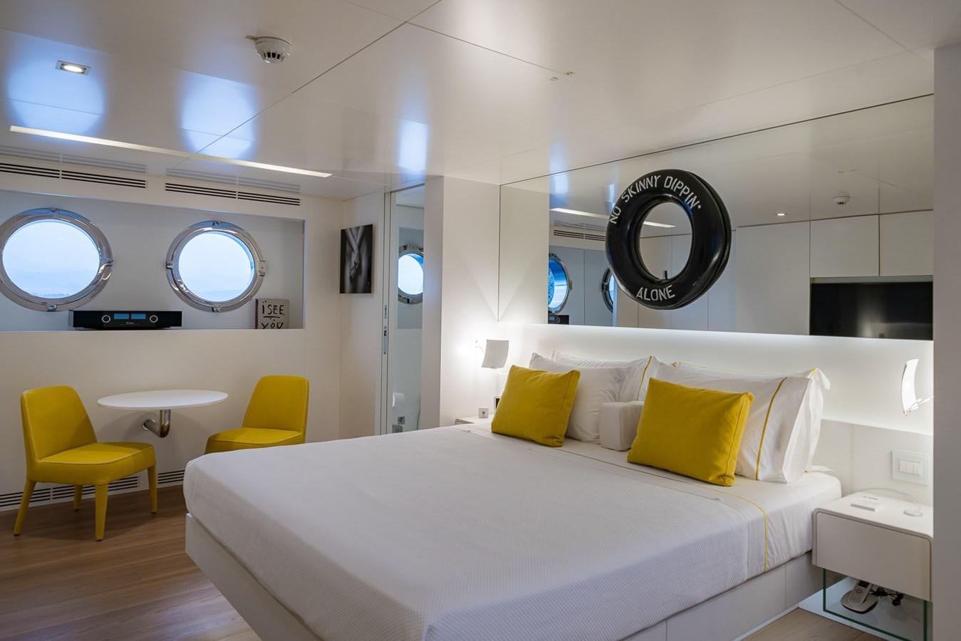 a room with a bed and a desk aboard ESOSH Yacht for Sale
